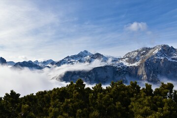 View of Triglav mountain peak in Julian alps, Slovenia with fog covering the alpine landscape bellow
