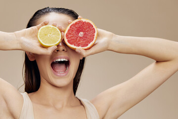 portrait woman grapefruit near face clean skin care health isolated background