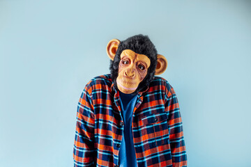 Fototapeta premium Man in monkey mask gesturing.