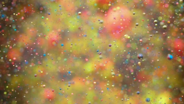 Colorful Bubbles Oil Beautiful Paint Universe Color Moving Multicolored. Holiday Background. Christmas. Galaxy Nebula Space Stars Planets. Milky Way. Fantastic surface with Chaotic motion liquid.