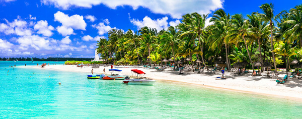 Idyllic tropical white sandy beach Trou aux biches with turquoise sea. Mauritius island holidays