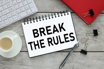 Break the rules Flat lay workplace with red notepad. stationery on a light background