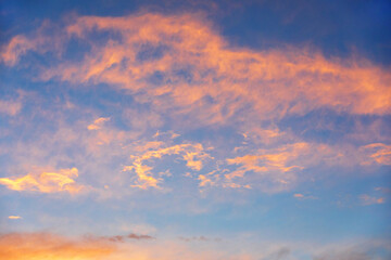 Naklejka na ściany i meble Blue sky at sunset. Orange and pink landscape
