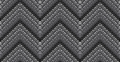 A unique, grey scale, dappled chevron pattern. This seamless vector pattern is a sophisticated monochrome great for backgrounds and surface designs.