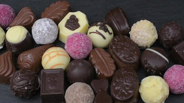 Assorted pralines with milk and dark chocolate. Loving chocolate and sweets concept. Variety chocolate truffles