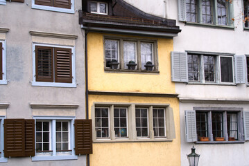 Fototapeta na wymiar Close-up of beautiful colorful facades of historic houses at medieval old town of Zürich on a winter day. Photo taken February 1st, 2022, Zurich, Switzerland.