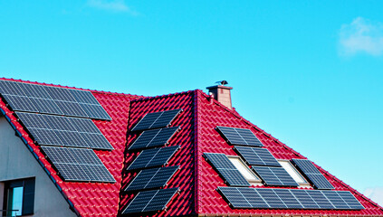 Modern solar panels on rooftop of private house