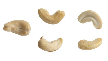 Macro photo of floating raw cashews on isolated white background.