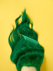 Unusual bright green natural hair colored with pigments on yellow. Beauty salon background for stories.