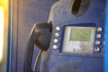 out of order abandoned public phone set with dirt and scratches
