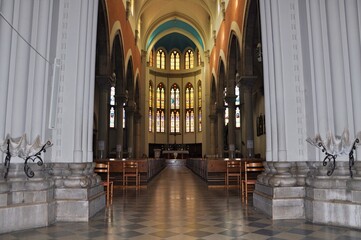 Fototapeta premium Central altar and stained glass windows in the background of the Capuchin Church of Our Lady of Lourdes in Rijeka.The church is a unique example of eclecticism in Rijeka.