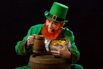 Leprechaun elf on St. Patrick's Day. Cheerful character Irish leprechaun for advertising with a red...