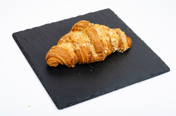Fresh sweet croissants for breakfast on white. Studio Photo