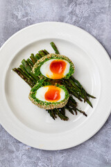 Vegetarian Scotch egg wrapped in pea and broad bean mash
