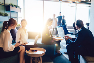 Contemporary multiethnic employees in hall of office