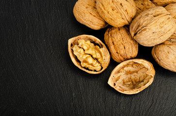 Ripe walnuts on black background. Studio Photo