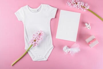 Baby shower invitation 5x7 card mockup with baby accessories girl bodysuit, nipple or baby's dummy,...