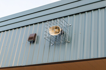 Loudspeaker on a wall. Megaphone on the school building