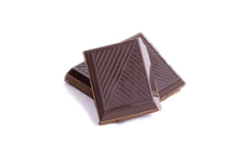 Pieces and chopped chocolate close up macro isolated on white background