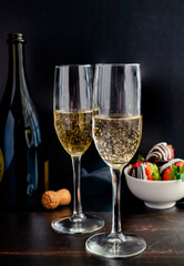 Full Length View of Champagne in Flute Glasses: Bubbly sparkling wine in champagne glasses with...