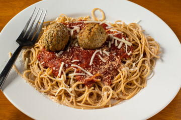 spaghetti top with cheese and sauce