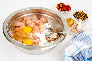 Pieces of chicken fillet, raw eggs, spices for cooking. Studio Photo