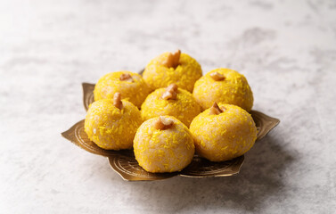 traditional indian sweets laddu on concrete background