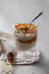Delicious dessert with cream, fresh mango with chia seeds and muesli.