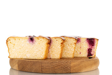 Several slices of homemade cottage cheese casserole with cherries on a wooden tray, macro, isolated on a white background.

