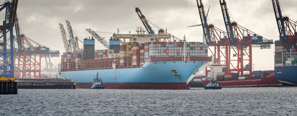 Large container ship leaves the port of Hamburg 