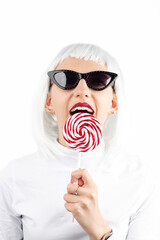 Retro, fashion, lifestyle concept. Beautiful woman with white wig, white outfit, retro sunglasses...