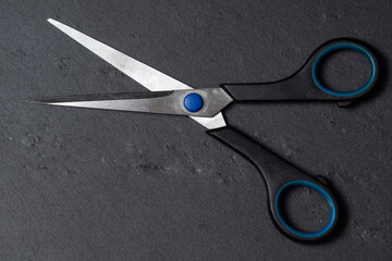  old scissors on a black background