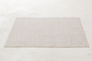 Perspective view of brown tablecloth for food on cement background. Empty space for your design