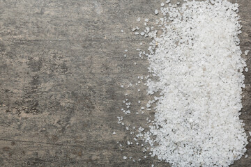 Background from white sea salt. Coarse rock salt texture witth copy space