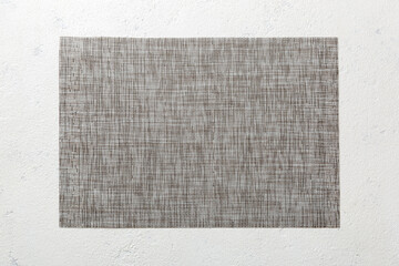 Fototapeta premium Top view of grey tablecloth for food on cement background. Empty space for your design