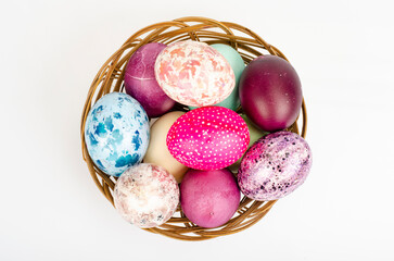 Bright colored Easter eggs on platter, holiday background. Studio Photo