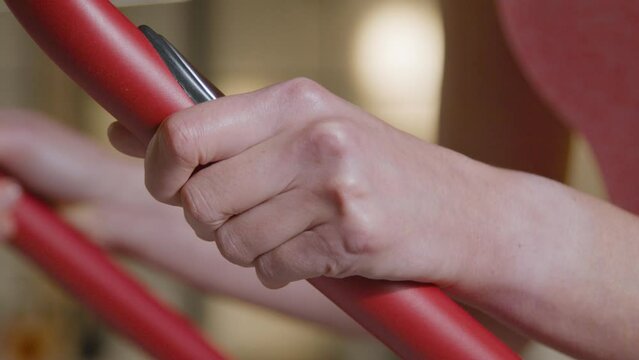 Close Up Shot of Woman's Hands whilst Working Out at Gym