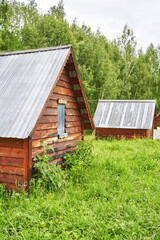Wood house in forest. Local travel concept. Sustainable lifestyle. Summer staycation vacation....