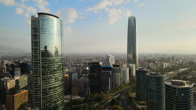 Aerial dolly in of modern window glass skyline skyscrapers in Sanhattan area at daytime, Santiago, Chile