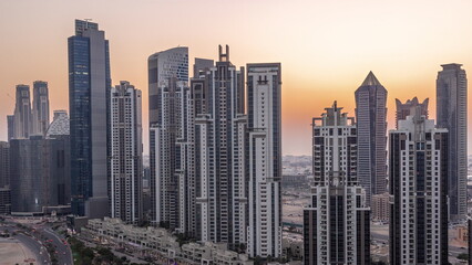 Bay Avenue with modern towers residential development in Business Bay aerial day to night timelapse, Dubai