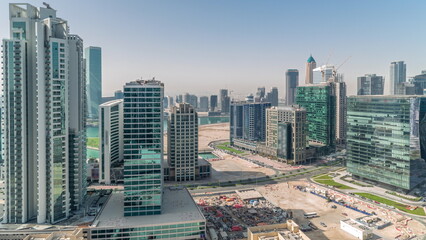 Business Bay Dubai skyscrapers with water canal aerial timelapse.