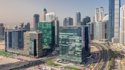 Fototapeta na wymiar Business Bay Dubai skyscrapers with construction site aerial timelapse.