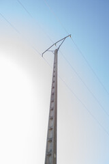 Electrical tower with cables in vault and concrete mast