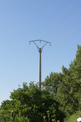 Electrical tower with cables in vault and concrete mast