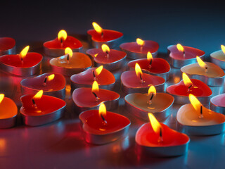 burning colored scented heart shaped candles