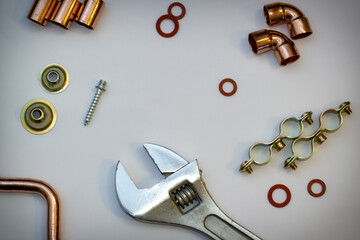 plumbing tool such as copper, pvc, wrench, gasket, hose clamp, on white  background.