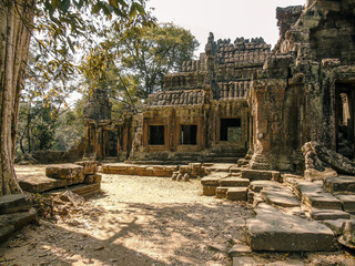 Ruins of an ancient stone temple lost in the Cambodian jungle - Banteay Kdei of Angkor temples