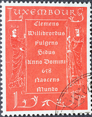 Luxembourg - circa 1958: a postage stamp from Luxembourg, showing a text in memory of St. Willibrord
