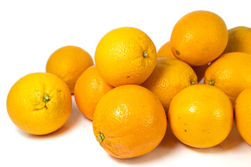 Stack of fresh oranges on white background. Healthy juicy oranges isolated.