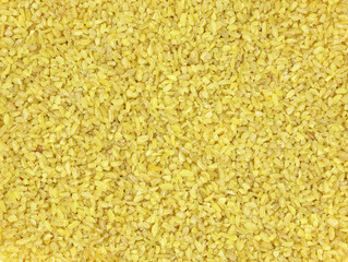 Bulgur groats from crushed wheat close-up. Bulgur background. Durum wheat top view.